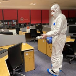 Contego technician disinfecting an office space.
